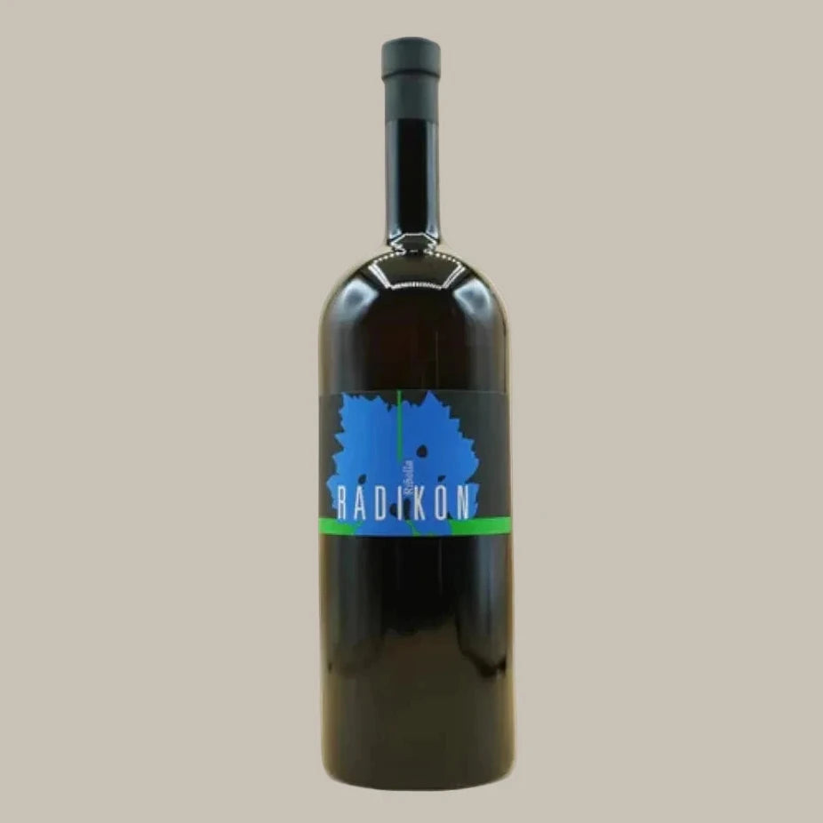 Black bottle with a blue label on a beige background