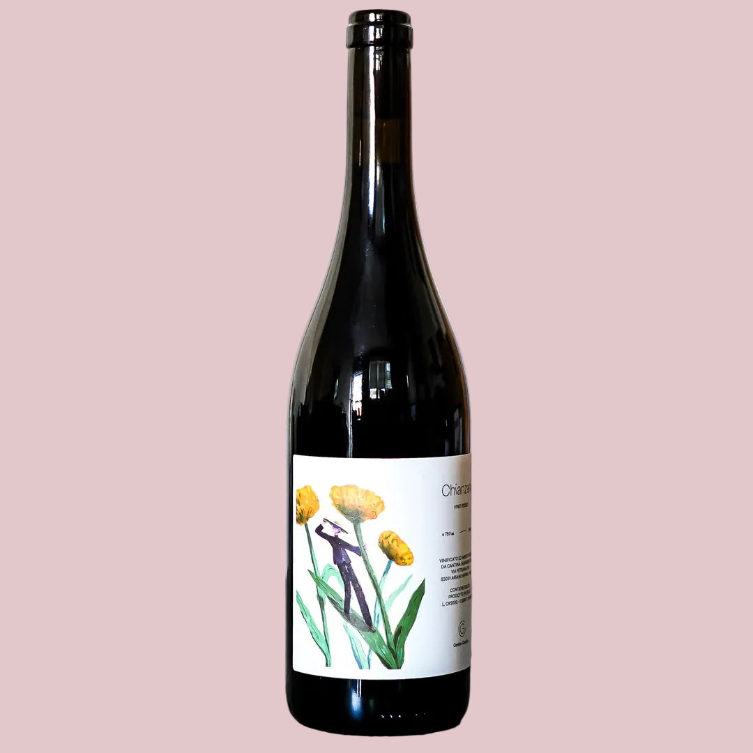 Wine bottle with a floral label on a gray surface and white background