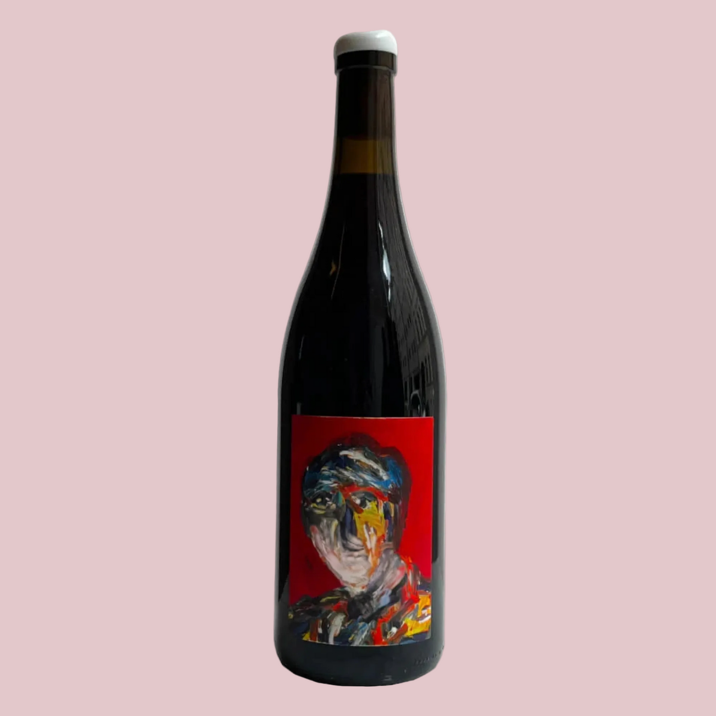 Wine bottle with a colorful label on a beige background