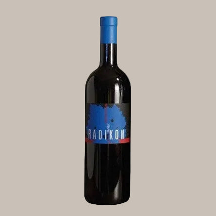 Wine bottle with a blue label on a beige background