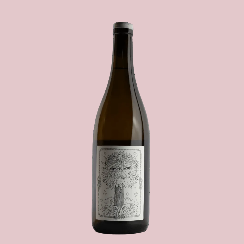 Wine bottle with a decorative label on a beige background