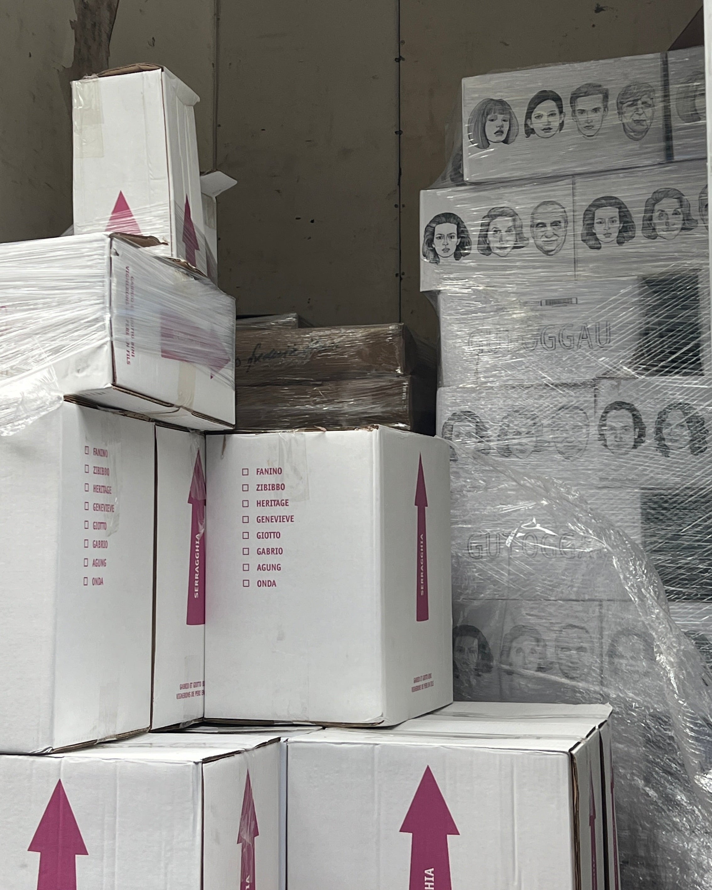 Stack of boxes with branding on a warehouse floor
