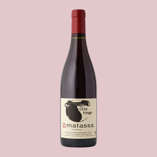 Red wine bottle with a visible label on a white background